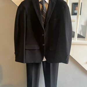 Van Heusen Black Suit, white dress shirt and clip on tie.